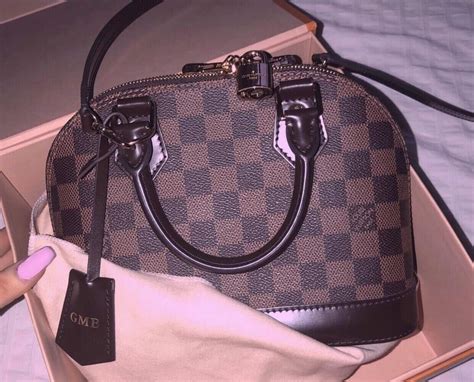 how to spot a fake alma bb louis vuitton|louis vuitton alma bag hardware.